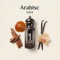A perfume bottle labeled 'Arabisc N114' centered on a warm cream background, surrounded by scent-inspired props including cinnamon sticks, caramel swirl, vanilla beans, and a small orchid flower. The bottle is dark smoky glass with a glossy black cap and a white abstract logo on the front.